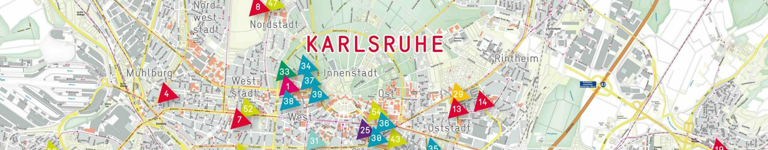 Ausschnitt aus einem Lageplan von Karlsruhe mit durchnummerierten Dreiecken, die die Standorte der stja-Einrichtungen markieren