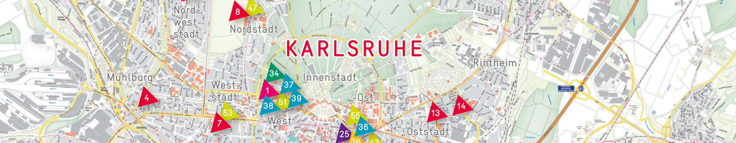Ausschnitt aus einem Lageplan von Karlsruhe mit durchnummerierten Dreiecken, die die Standorte der stja-Einrichtungen markieren